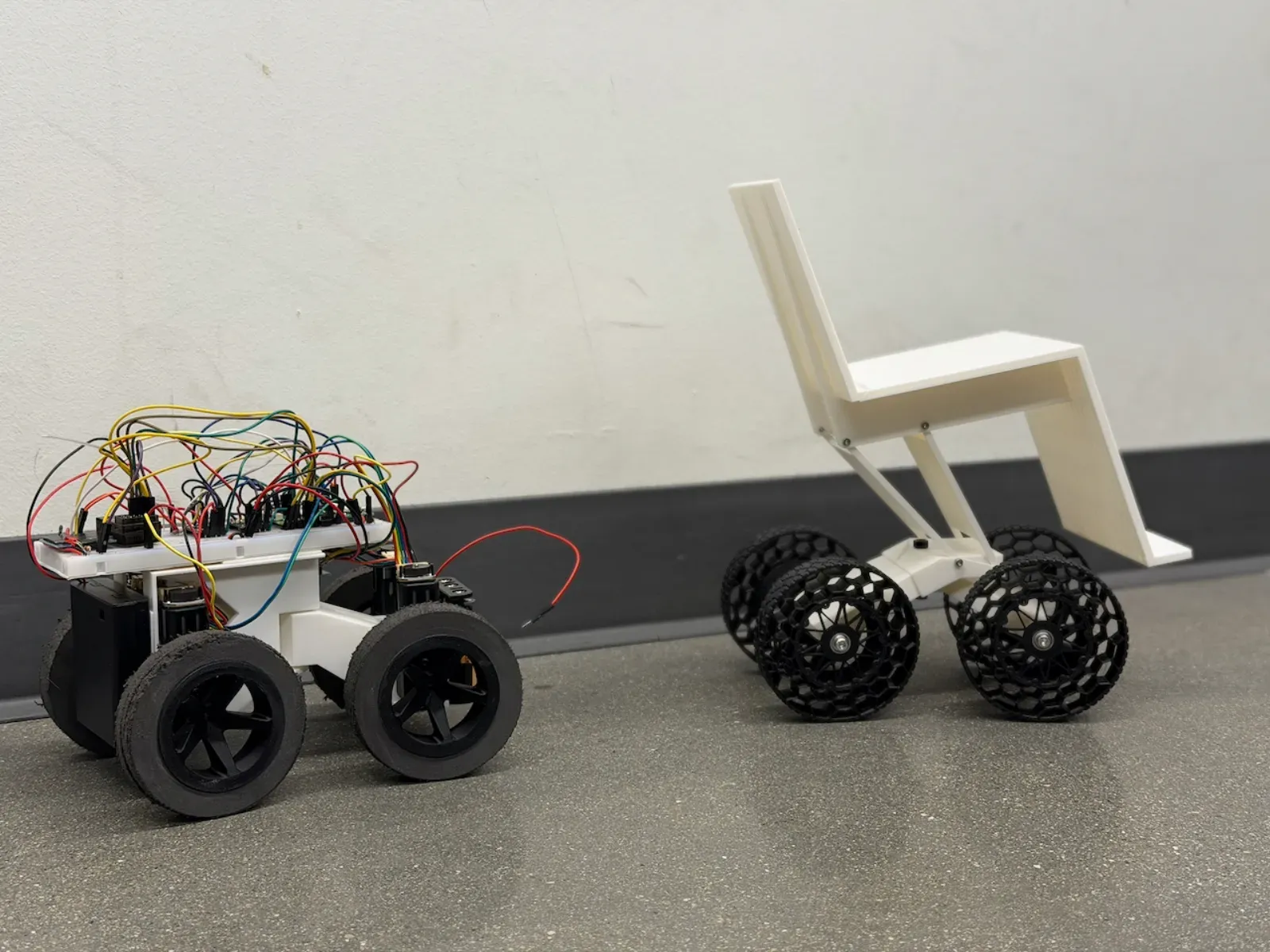 Miniwheely 1/4-scale platform next to the full-scale Flowheely chassis